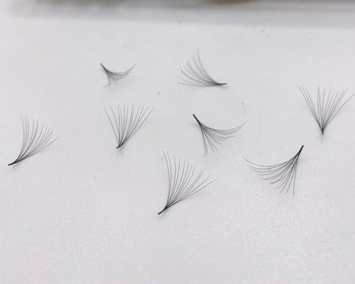 Eyelash extensions premade volume fans 12D with a package labeled 'Pinneacle' on a white background